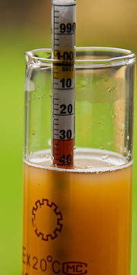 hydrometer in liquid in sample tube